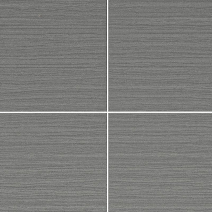 Textured gray ceramic tiles with white grout lines in a grid layout, modern matte finish tile flooring or wall design