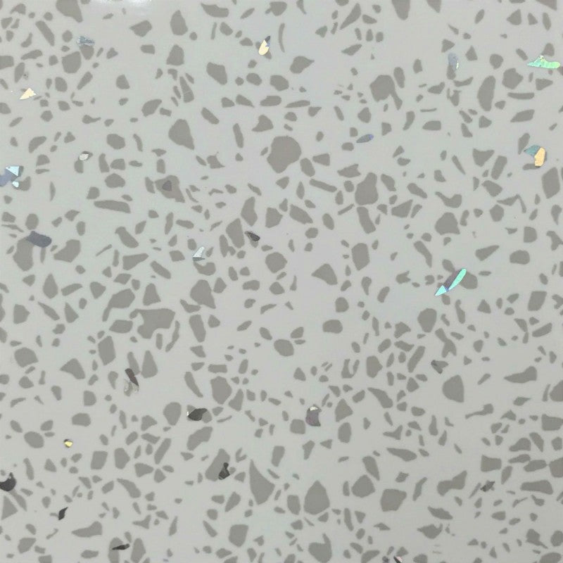 Terrazzo flooring pattern with gray background and varying shapes and sizes of stone chips